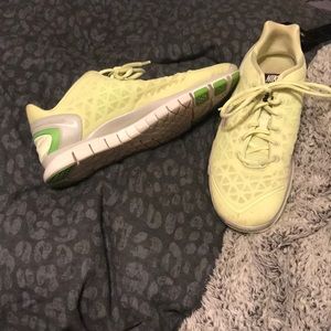 Lime green/neon yellow Nike tennis shoes